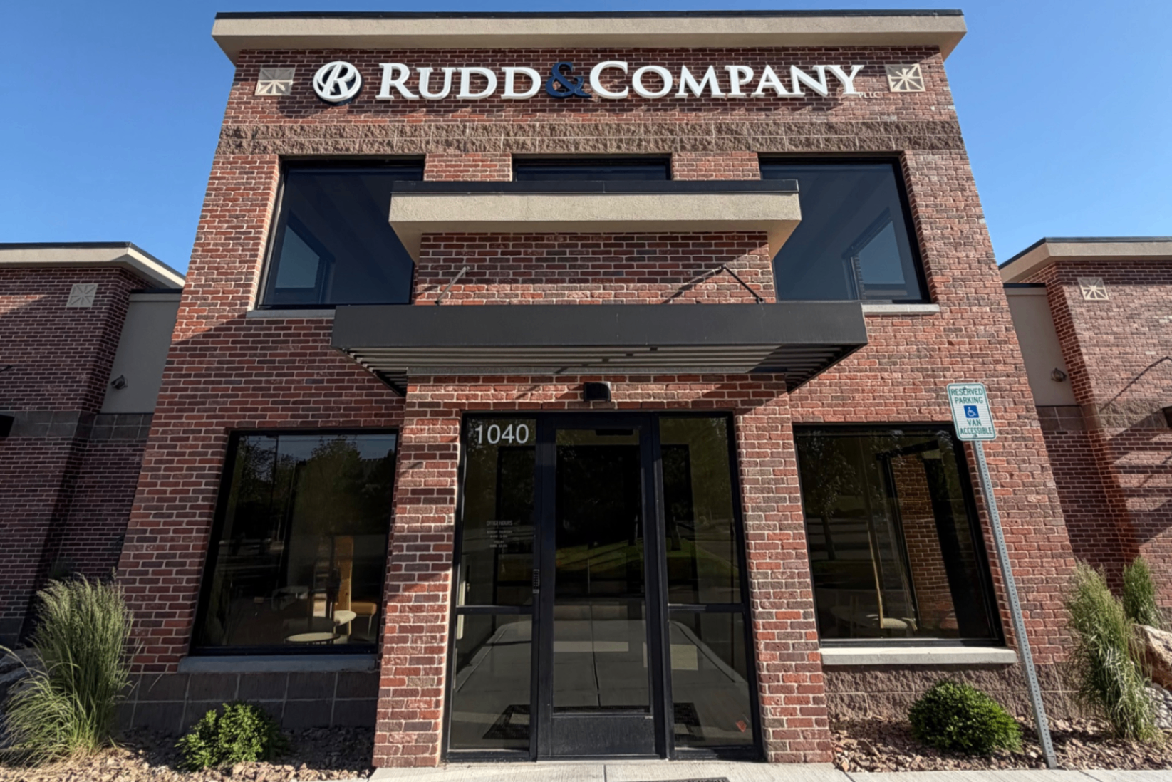 Detailed exterior cleaning at a commercial office entrance